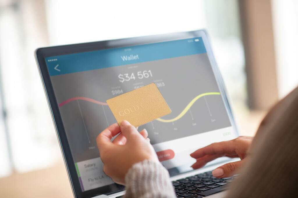 Close Up Of Woman Checking Balance Of Bank Account Online - Valli Contabilidade